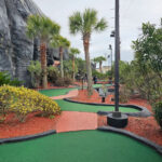 Outdoor Playing Area With Curved Paths and Obstructing Light Poles